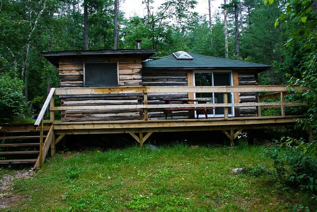 large log cabin for rent on Norcan Lake with big front deck