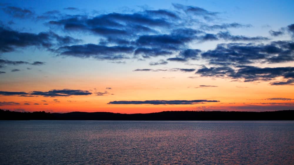 orange and blue sky at sunset over Black Donald Centennial Lake